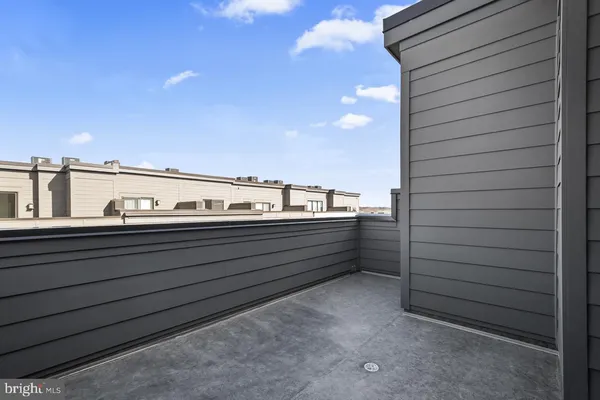 a picture of a bench in front of a building
