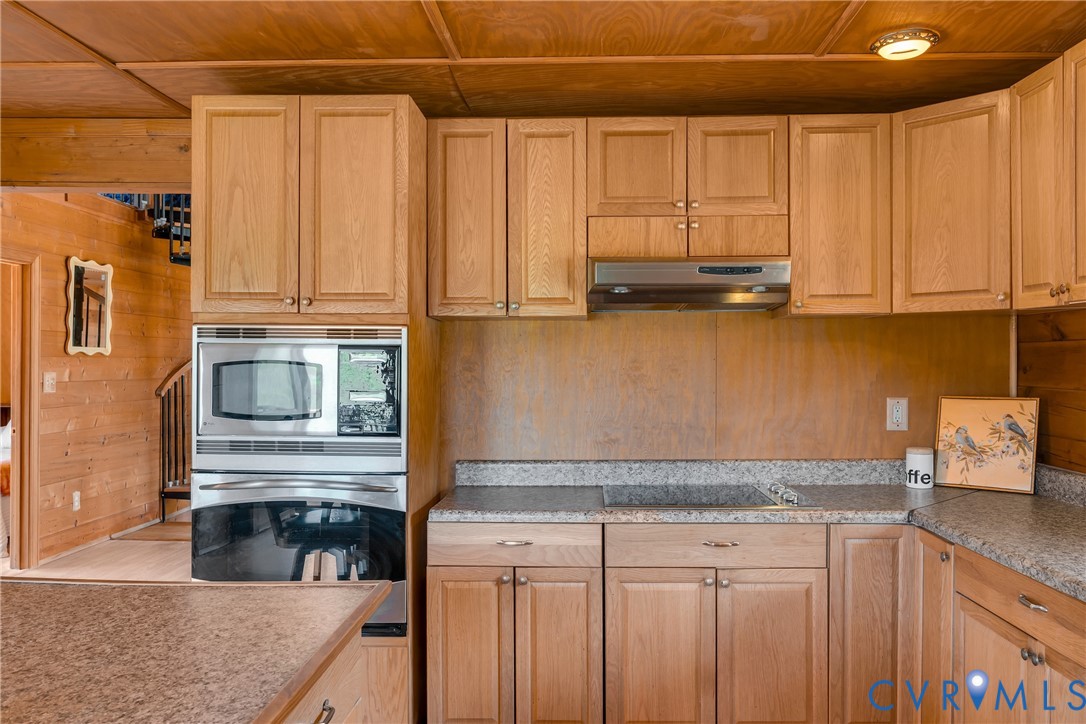 3000 Mineral Springs Road Boydton, VA 23917 - Photo 11 of 42 a kitchen with stainless steel appliances granite countertop a sink a stove and cabinets