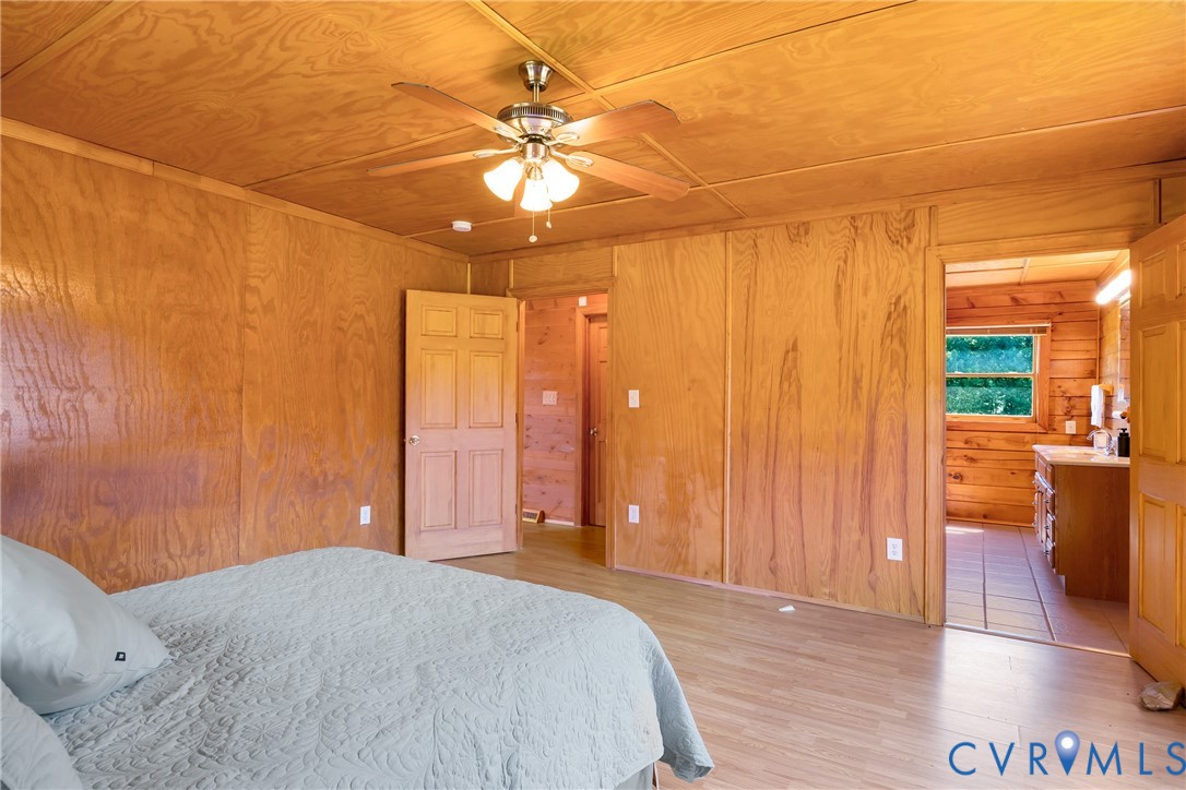 3000 Mineral Springs Road Boydton, VA 23917 - Photo 17 of 42 a view of a livingroom with a chandelier fan and wooden floor