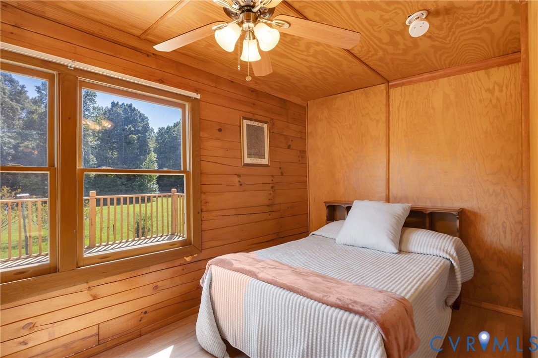 3000 Mineral Springs Road Boydton, VA 23917 - Photo 21 of 42 a bedroom with a bed and wooden floor