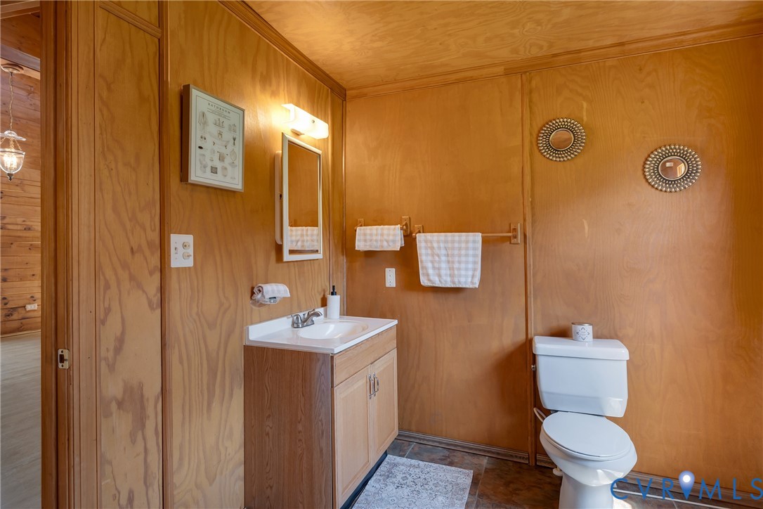 3000 Mineral Springs Road Boydton, VA 23917 - Photo 22 of 42 a bathroom with a toilet sink and mirror