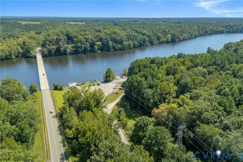 an aerial view of a houses with outdoor space and garden