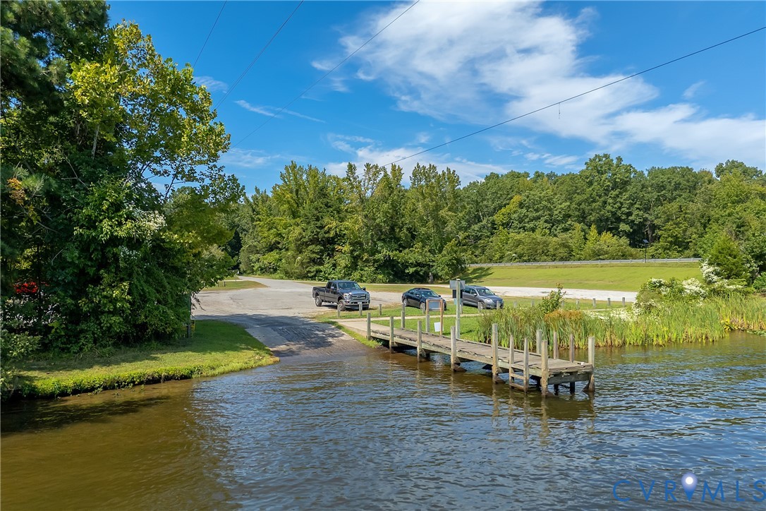 3000 Mineral Springs Road Boydton, VA 23917 - Photo 39 of 42 a view of a lake with lawn chairs