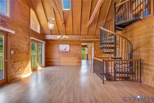 a view of a porch with wooden floor and roof