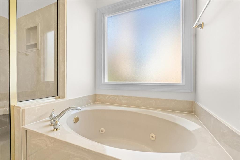 1030 Lakeview Parkway Villa Rica, GA 30180 - Photo 15 of 46 a white bath tub sitting next to a window