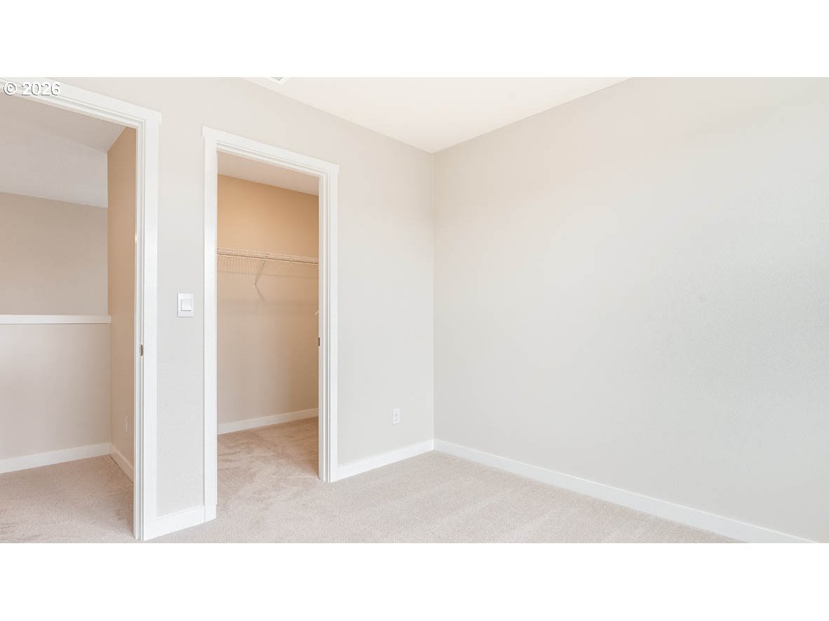 9194 Southeast Azalea Street Happy Valley, OR 97086 - Photo 18 of 32 a open living room with a hallway