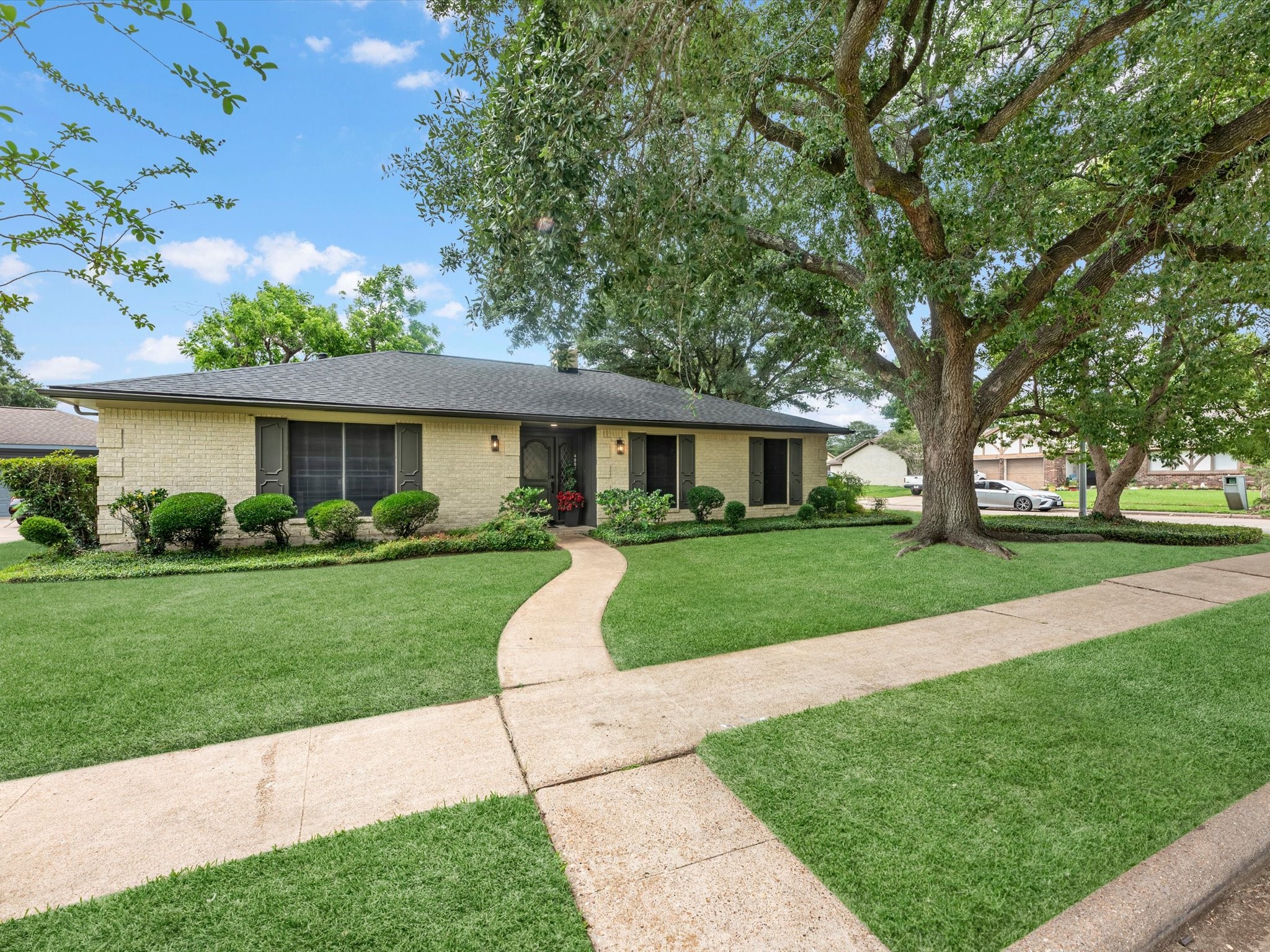 4002 Cujanes Street Pasadena, TX 77504 - Photo 2 of 26 a front view of a house with a yard