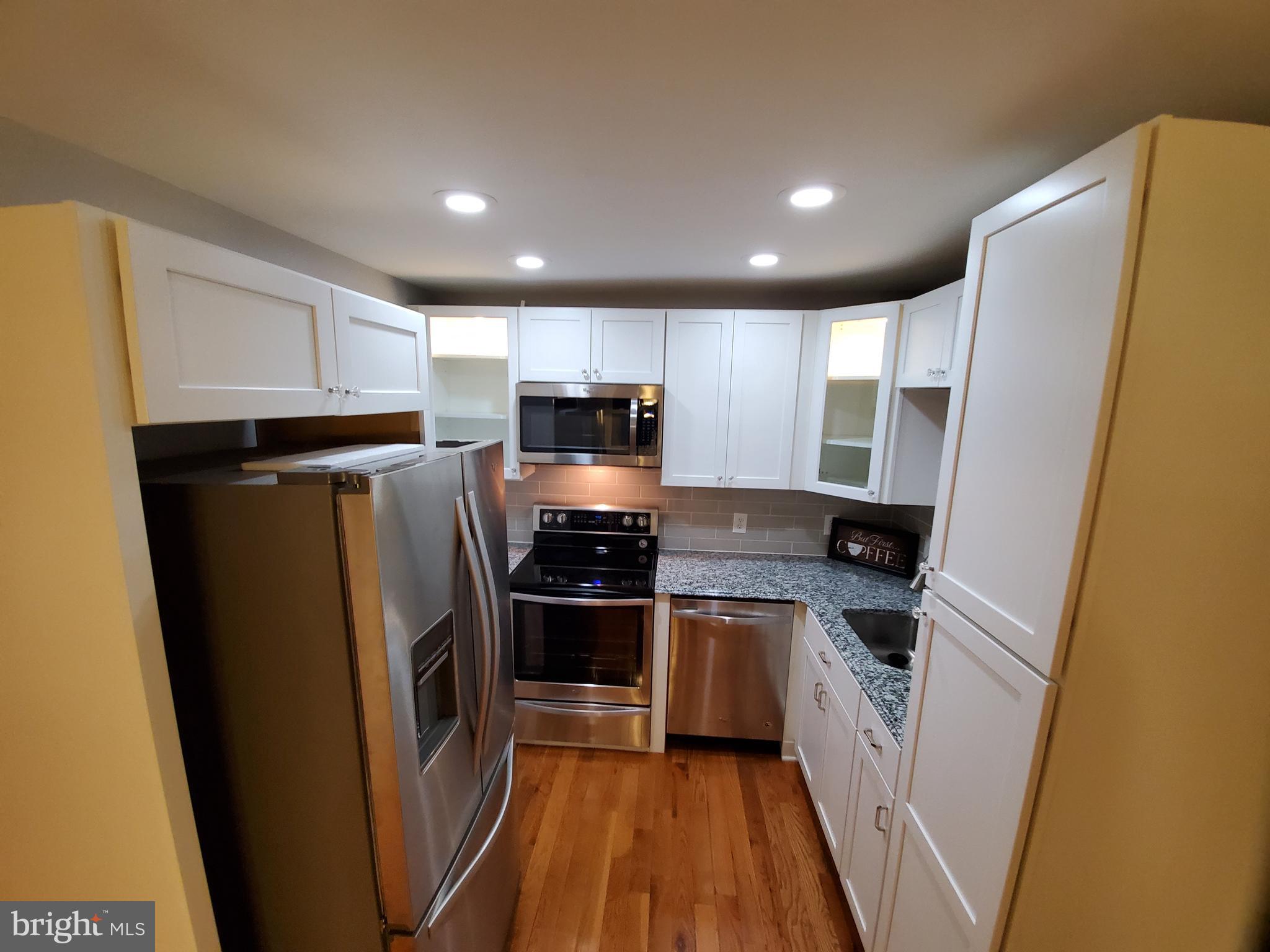 611 Drexel Road Fairless Hills, PA 19030 - Photo 9 of 30 Beautiful Kitchen With White & Glass Cabinets