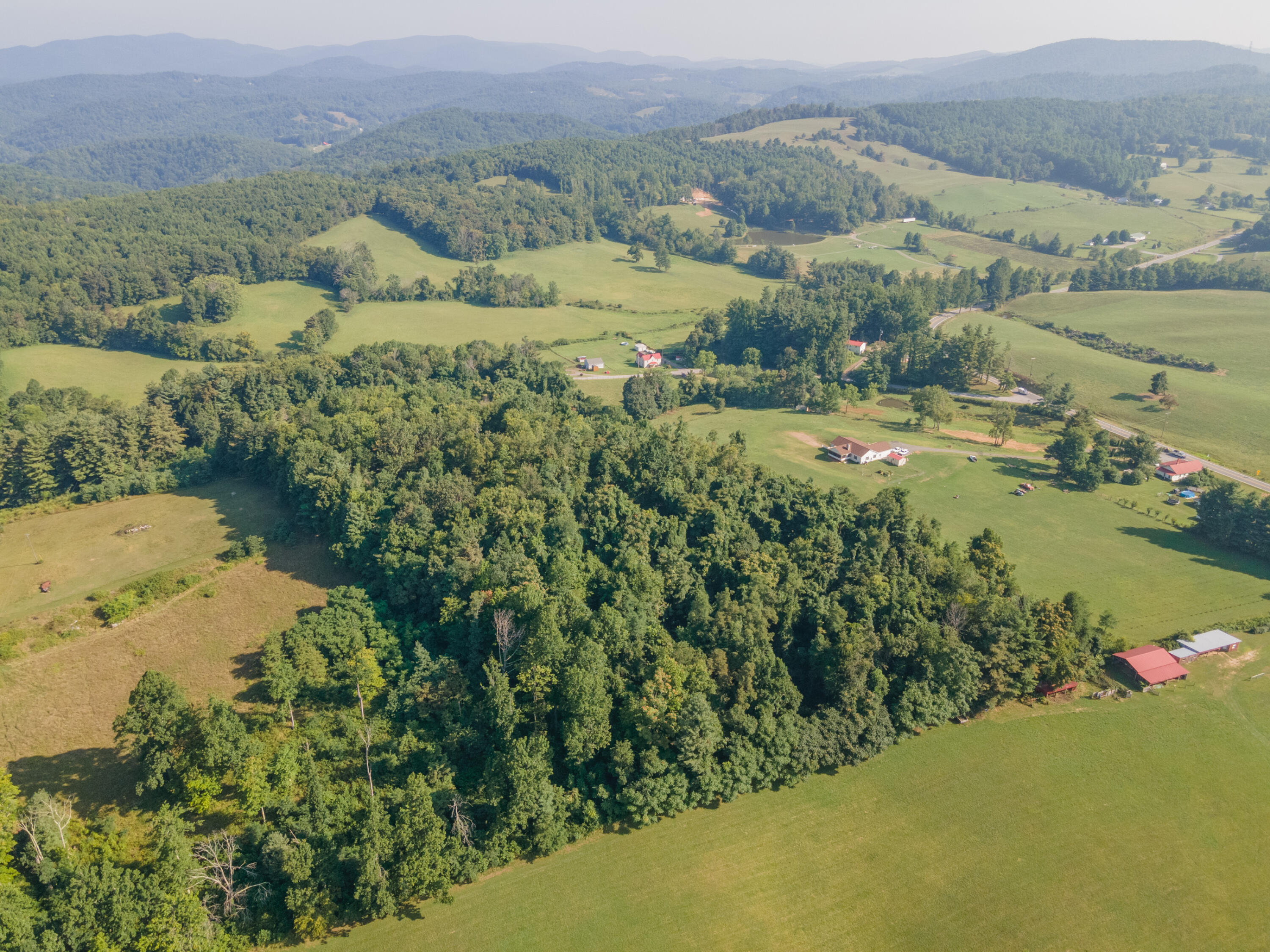 7950 Conner Road Northeast Copper Hill, VA 24079 - Photo 20 of 39 an aerial view of a houses with a yard and ocean view