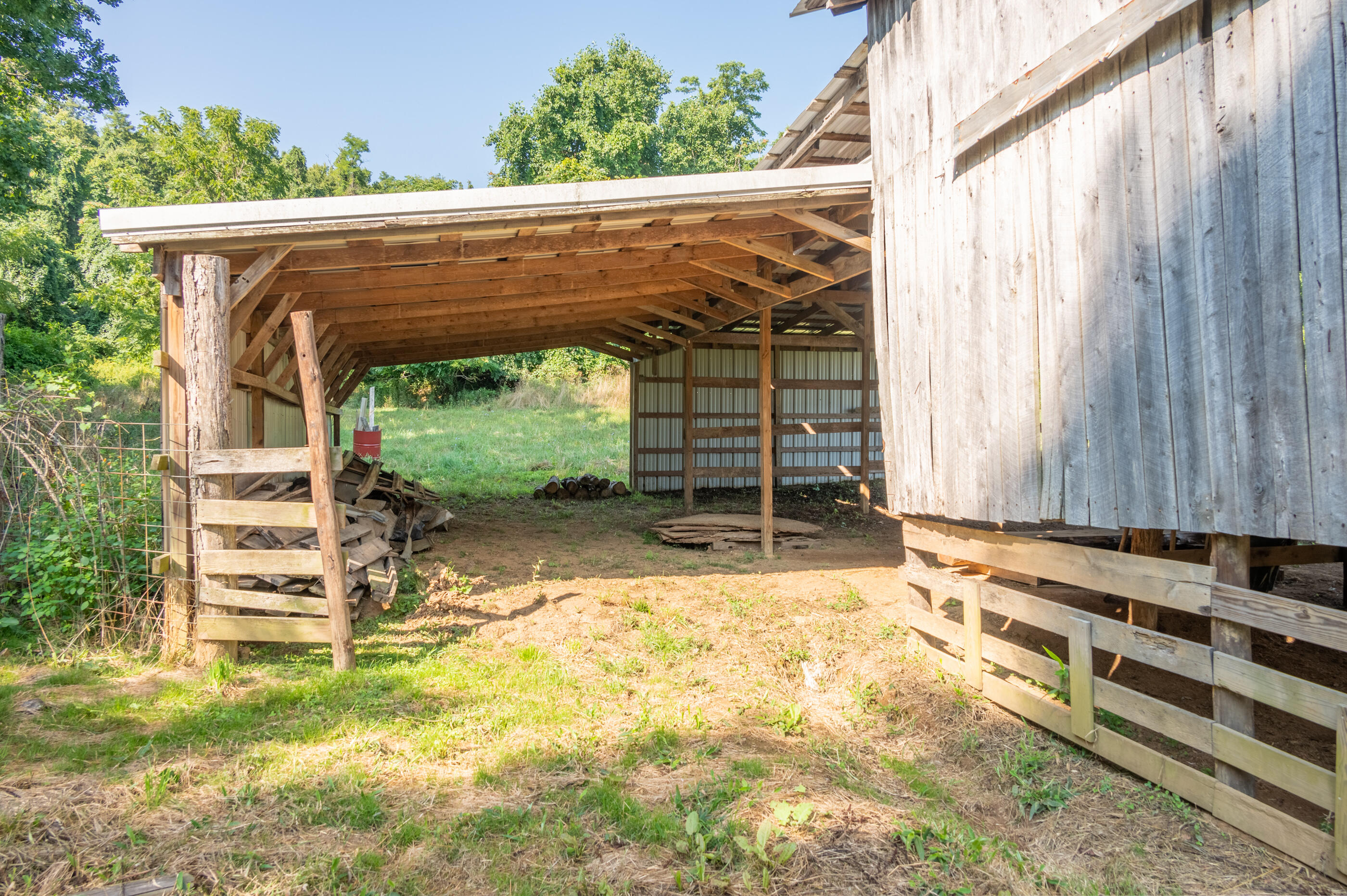 7950 Conner Road Northeast Copper Hill, VA 24079 - Photo 33 of 39 a backyard of a house with table and chairs