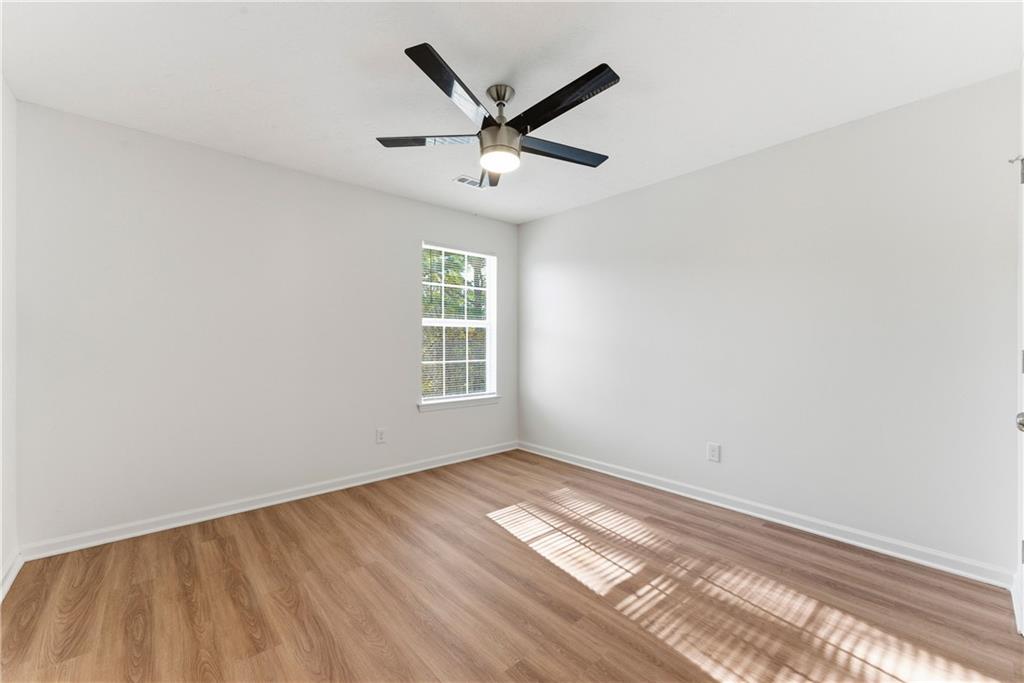 1500 Keystone Drive Conley, GA 30288 - Photo 17 of 25 wooden floor in an empty room with a window