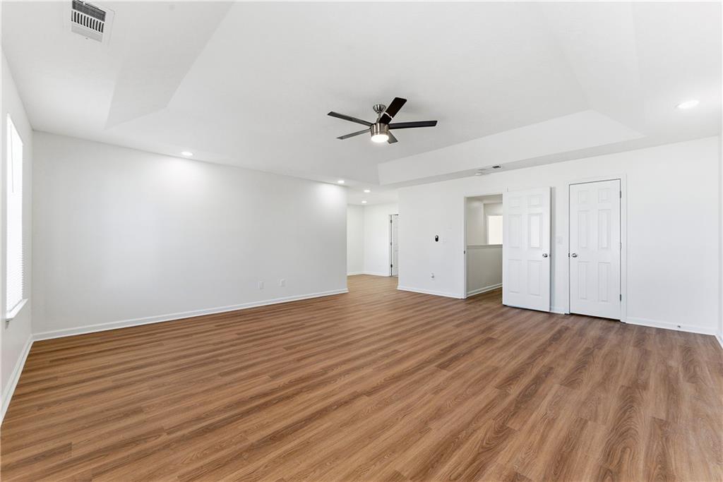 1500 Keystone Drive Conley, GA 30288 - Photo 19 of 25 a view of empty room with wooden floor and fan