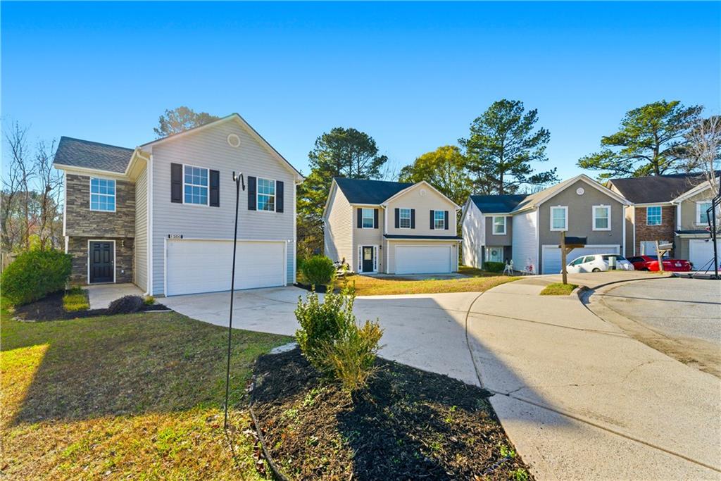 1500 Keystone Drive Conley, GA 30288 - Photo 2 of 25 a front view of house with yard and green space