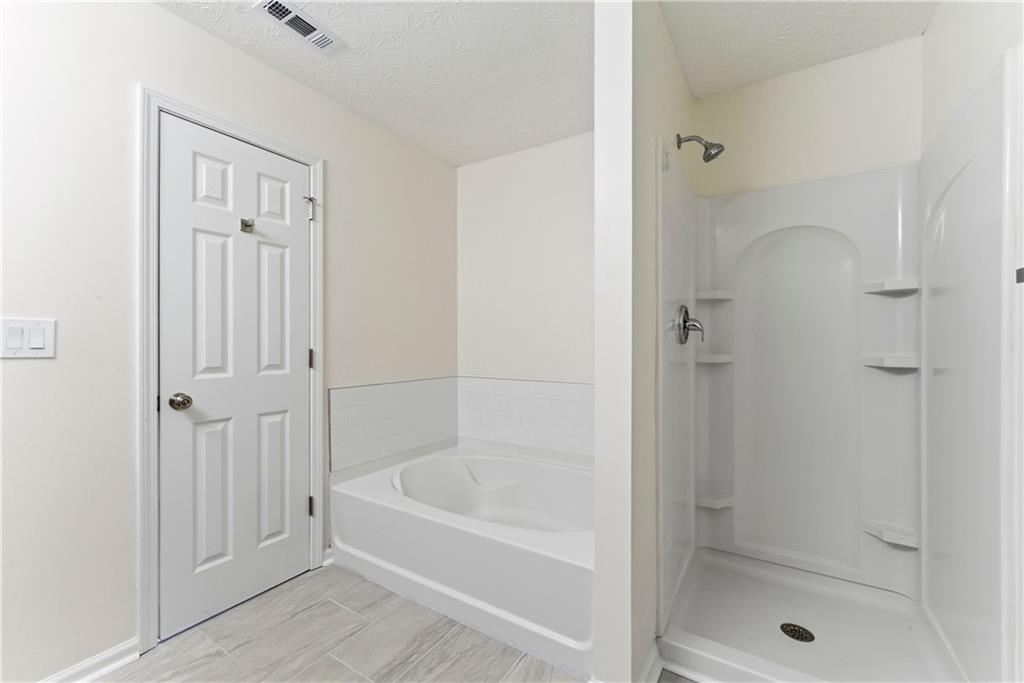 1500 Keystone Drive Conley, GA 30288 - Photo 21 of 25 a bathroom with a bathtub