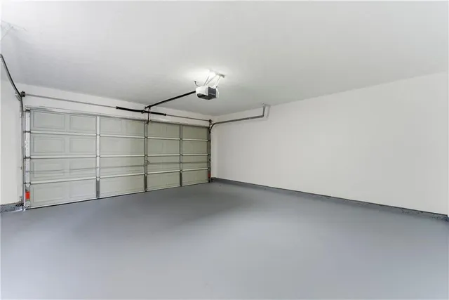 a front view of a house with a yard and outdoor seating