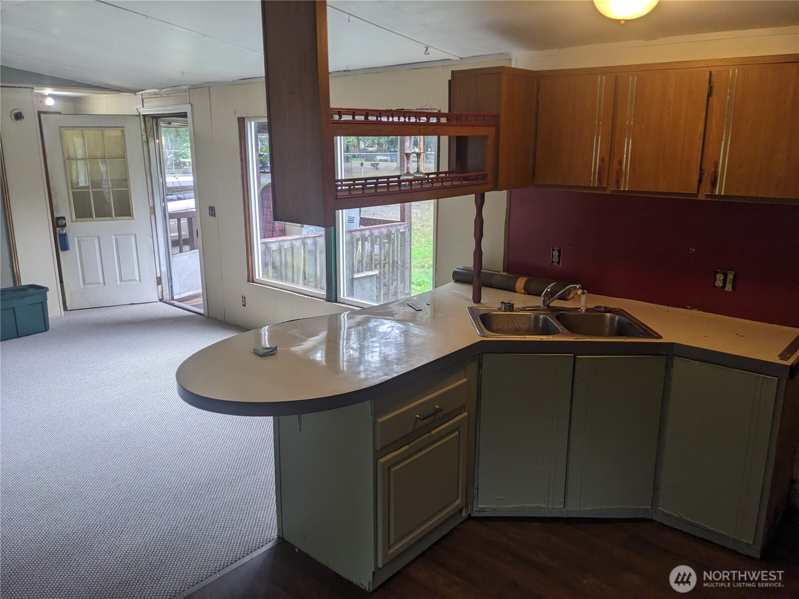 46400 Baker Loop Road Concrete, WA 98237 - Photo 7 of 12 a kitchen with a sink cabinets and wooden floor