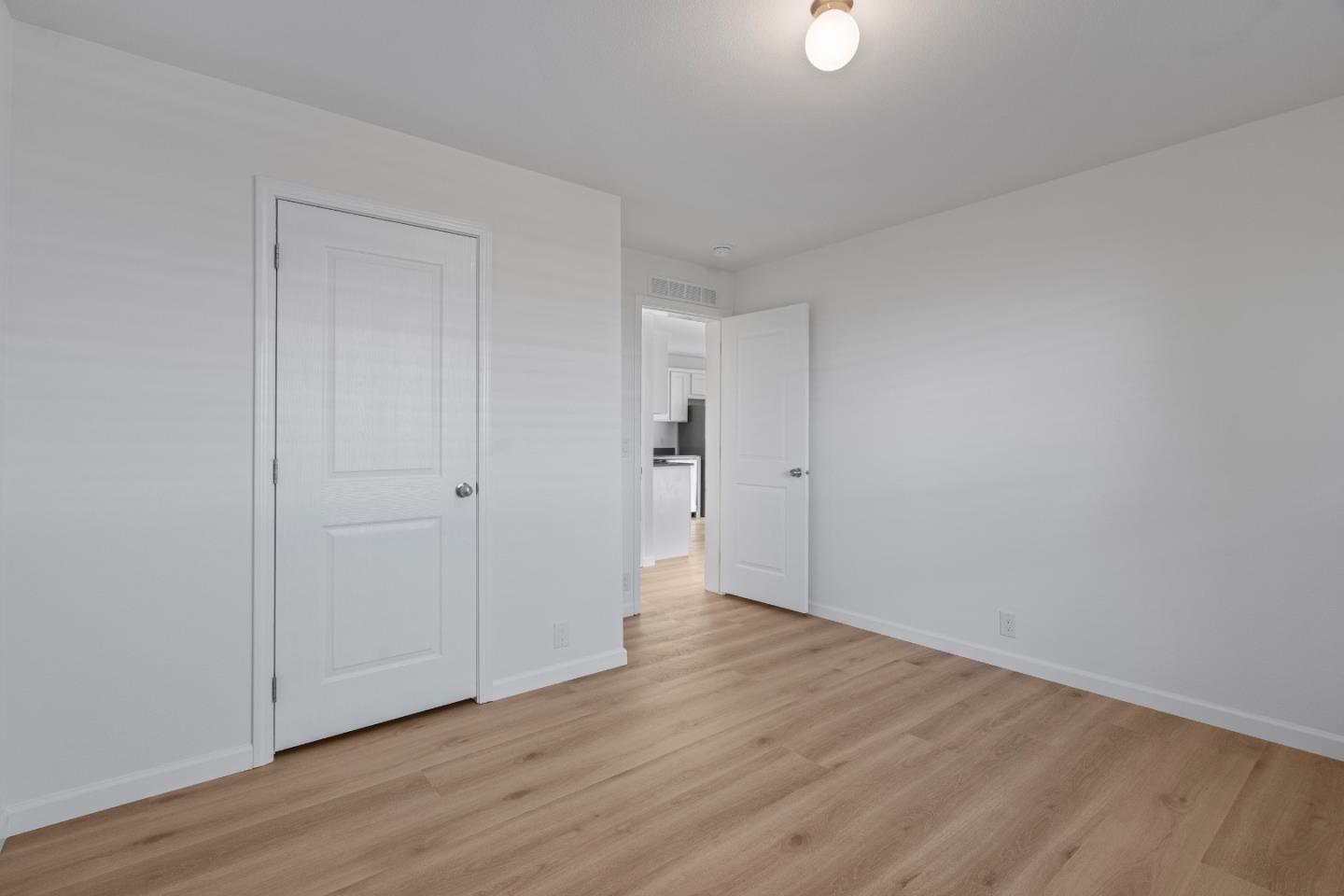 144 Holm Road, Unit 120 Watsonville, CA 95076 - Photo 17 of 25 a view of an empty room with wooden floor