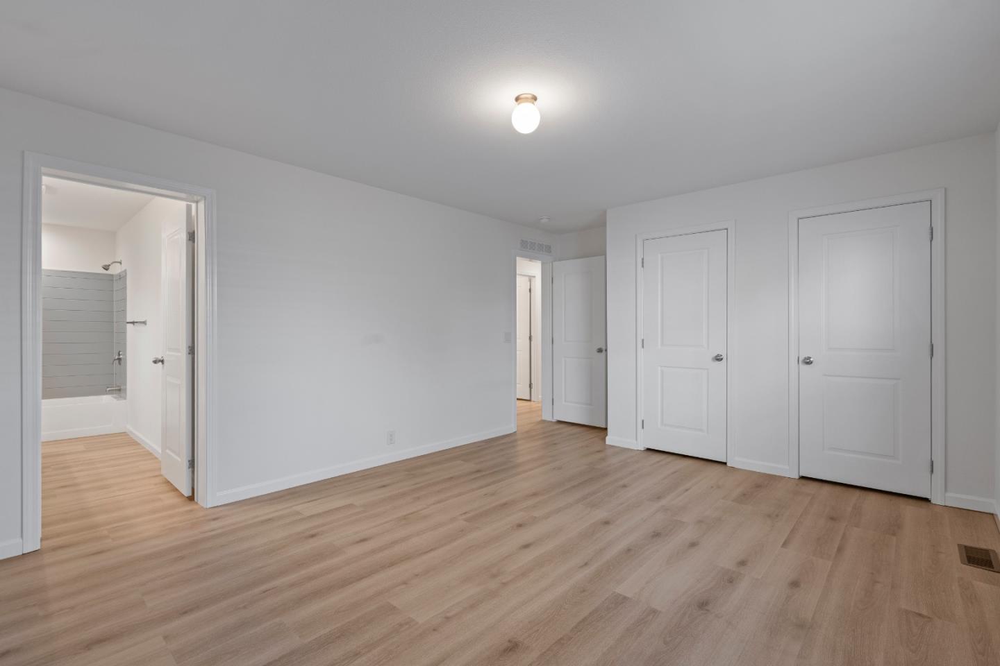 144 Holm Road, Unit 120 Watsonville, CA 95076 - Photo 19 of 25 a view of an empty room with wooden floor