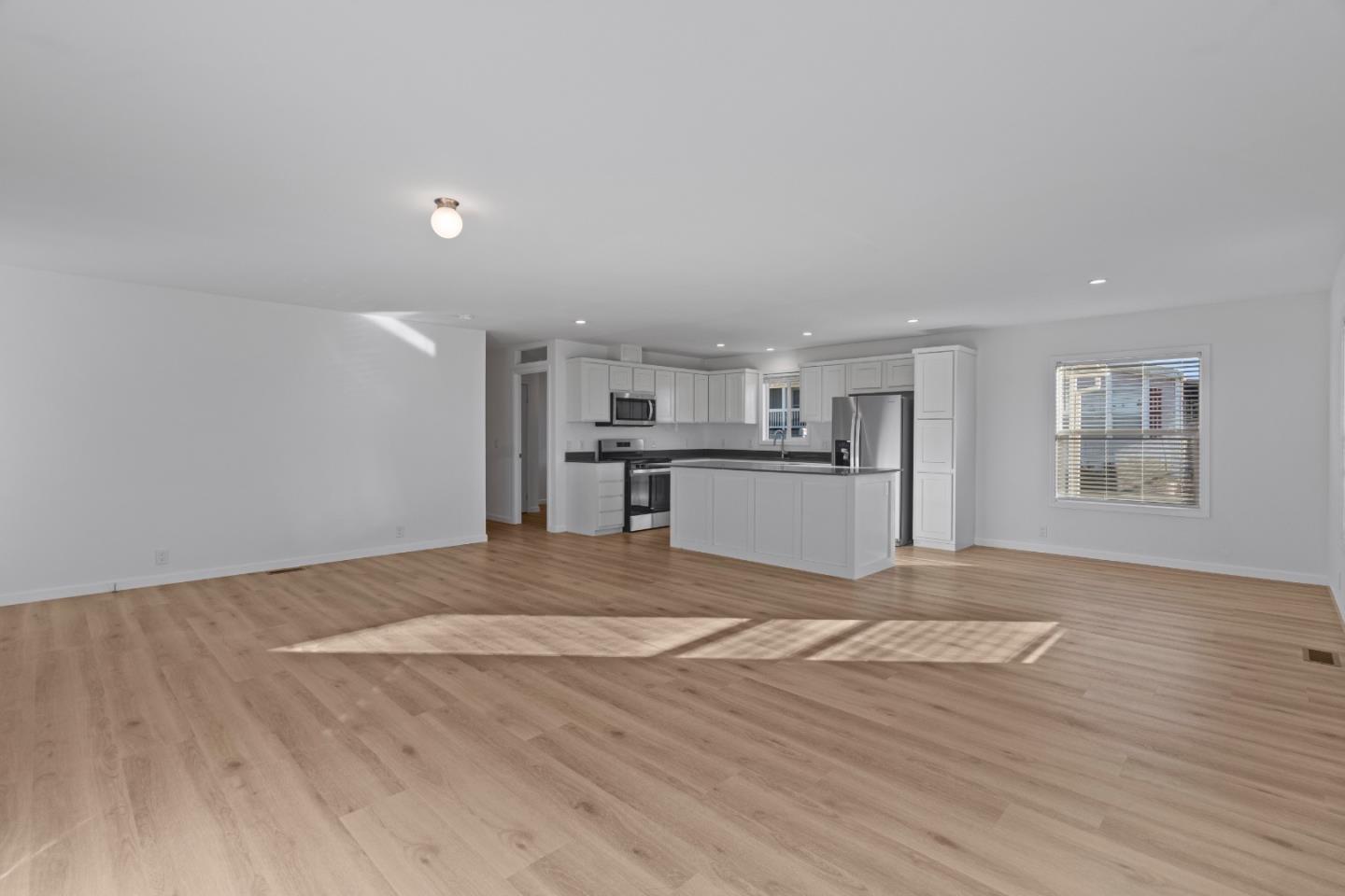 144 Holm Road, Unit 120 Watsonville, CA 95076 - Photo 10 of 25 a view of kitchen with wooden floor