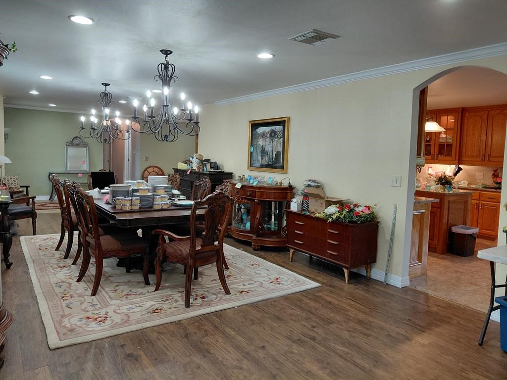1231 County Road 201A Angleton, TX 77515 - Photo 22 of 26 a view of a dining room with furniture and chandelier