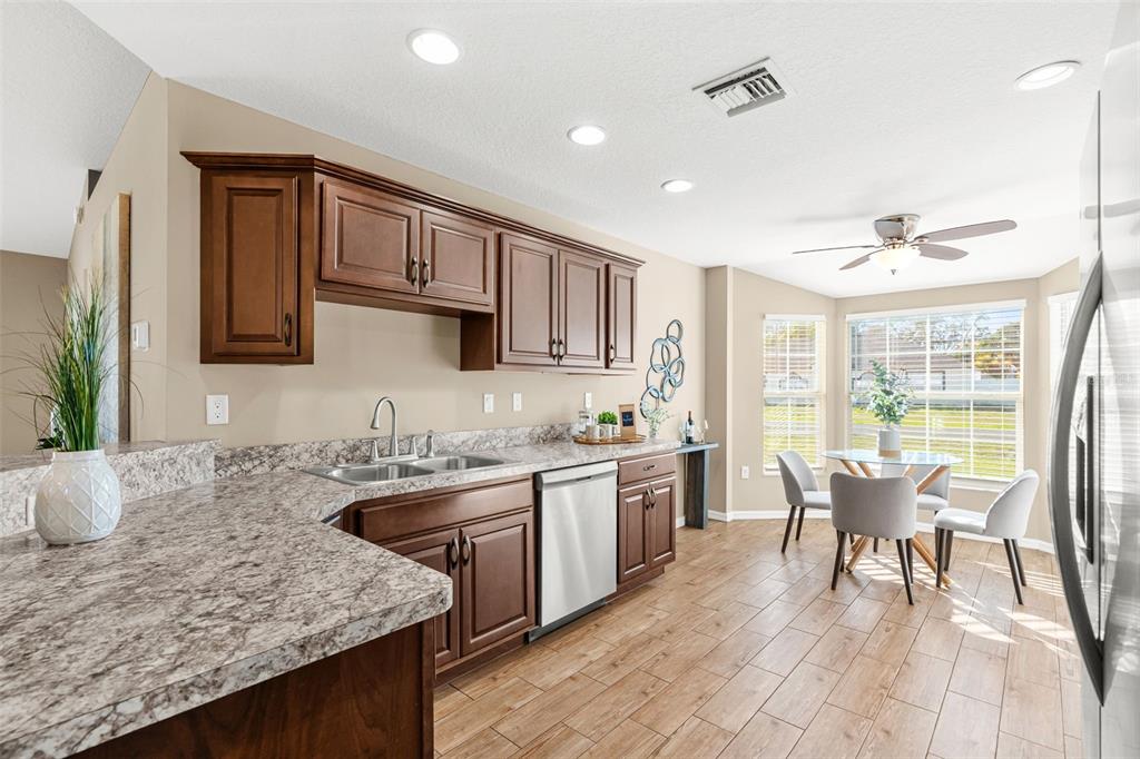 5346 Pierpoint Avenue Spring Hill, FL 34608 - Photo 12 of 41 a kitchen with a stove a sink and a refrigerator