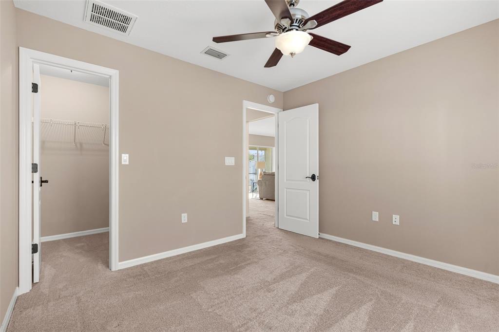 5346 Pierpoint Avenue Spring Hill, FL 34608 - Photo 24 of 41 an empty room with closet and a chandelier fan