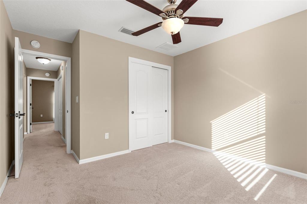 5346 Pierpoint Avenue Spring Hill, FL 34608 - Photo 26 of 41 an empty room with windows and fan