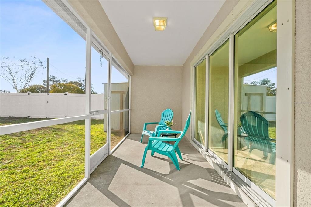 5346 Pierpoint Avenue Spring Hill, FL 34608 - Photo 29 of 41 a view of an chair and tables in the balcony