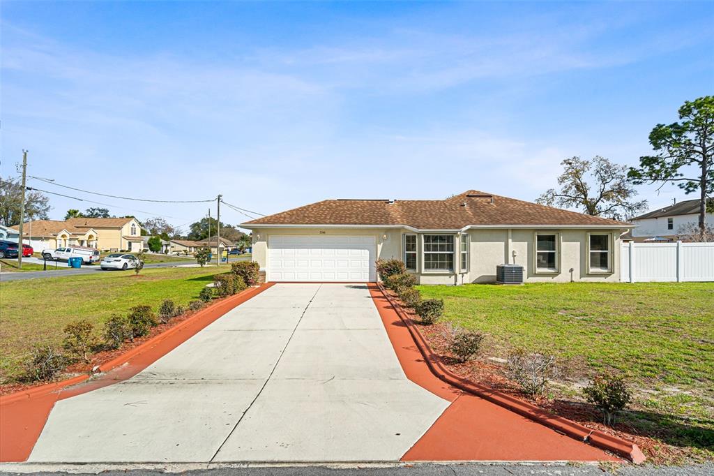 5346 Pierpoint Avenue Spring Hill, FL 34608 - Photo 3 of 41 a view of a house with a yard