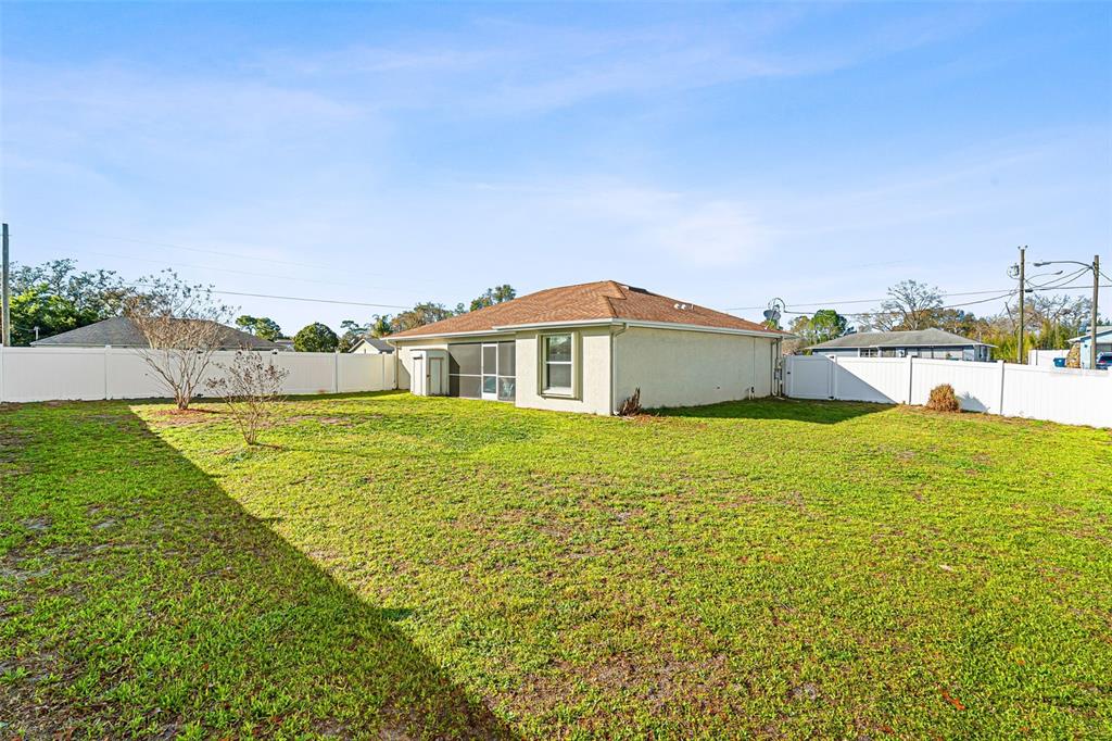 5346 Pierpoint Avenue Spring Hill, FL 34608 - Photo 33 of 41 a front view of a house with a yard