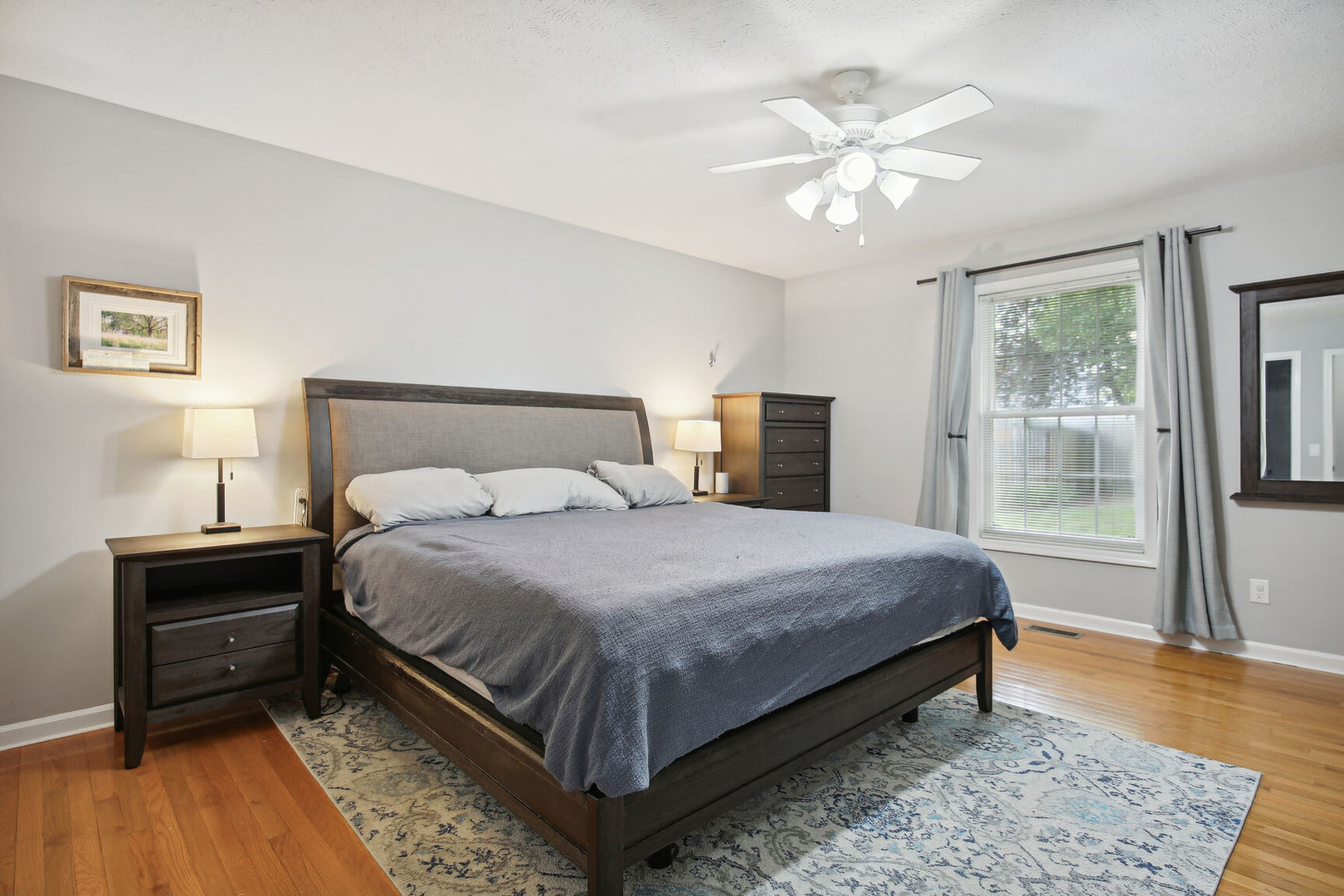 809 Lavender Drive Savoy, IL 61874 - Photo 12 of 27 a bedroom with a large bed and a chandelier