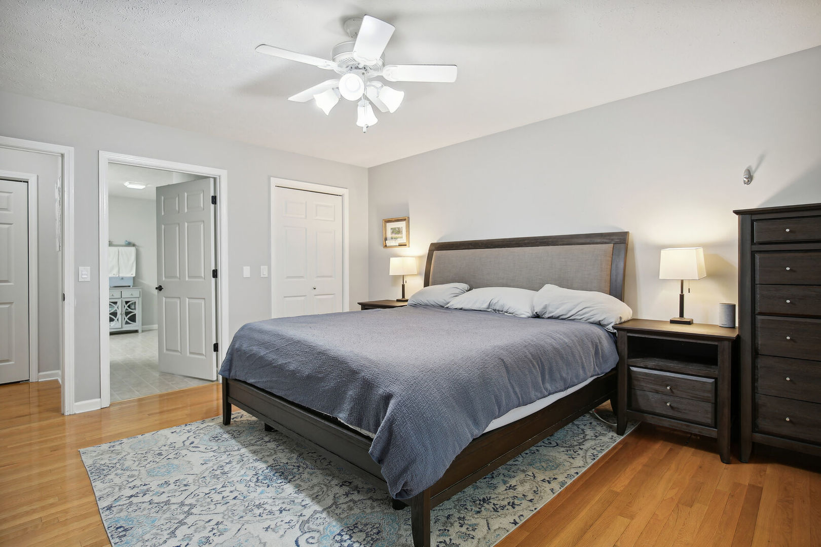 809 Lavender Drive Savoy, IL 61874 - Photo 13 of 27 a bedroom with a bed and a chandelier