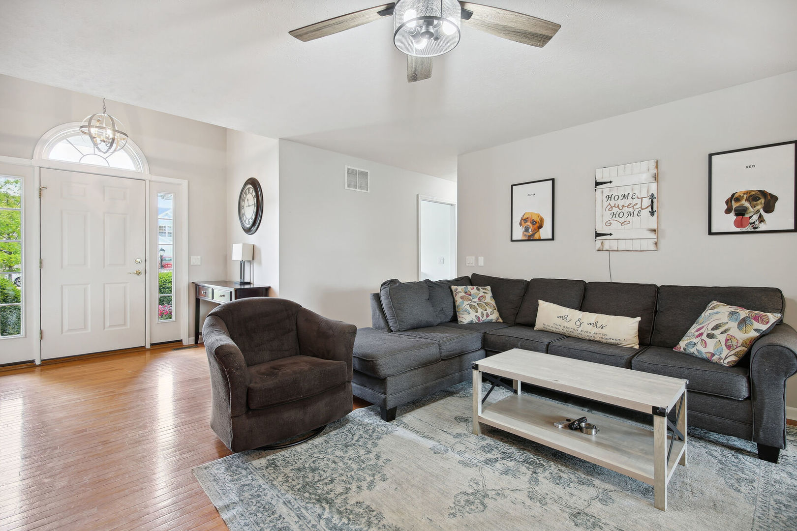 809 Lavender Drive Savoy, IL 61874 - Photo 6 of 27 a living room with furniture and a chandelier