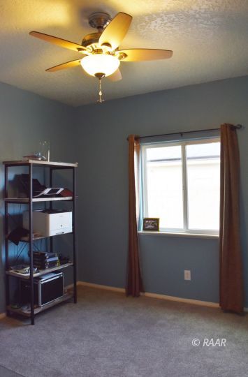 412 Abigail Street Ridgecrest, CA 93555 - Photo 8 of 14 an empty room with windows and cabinet