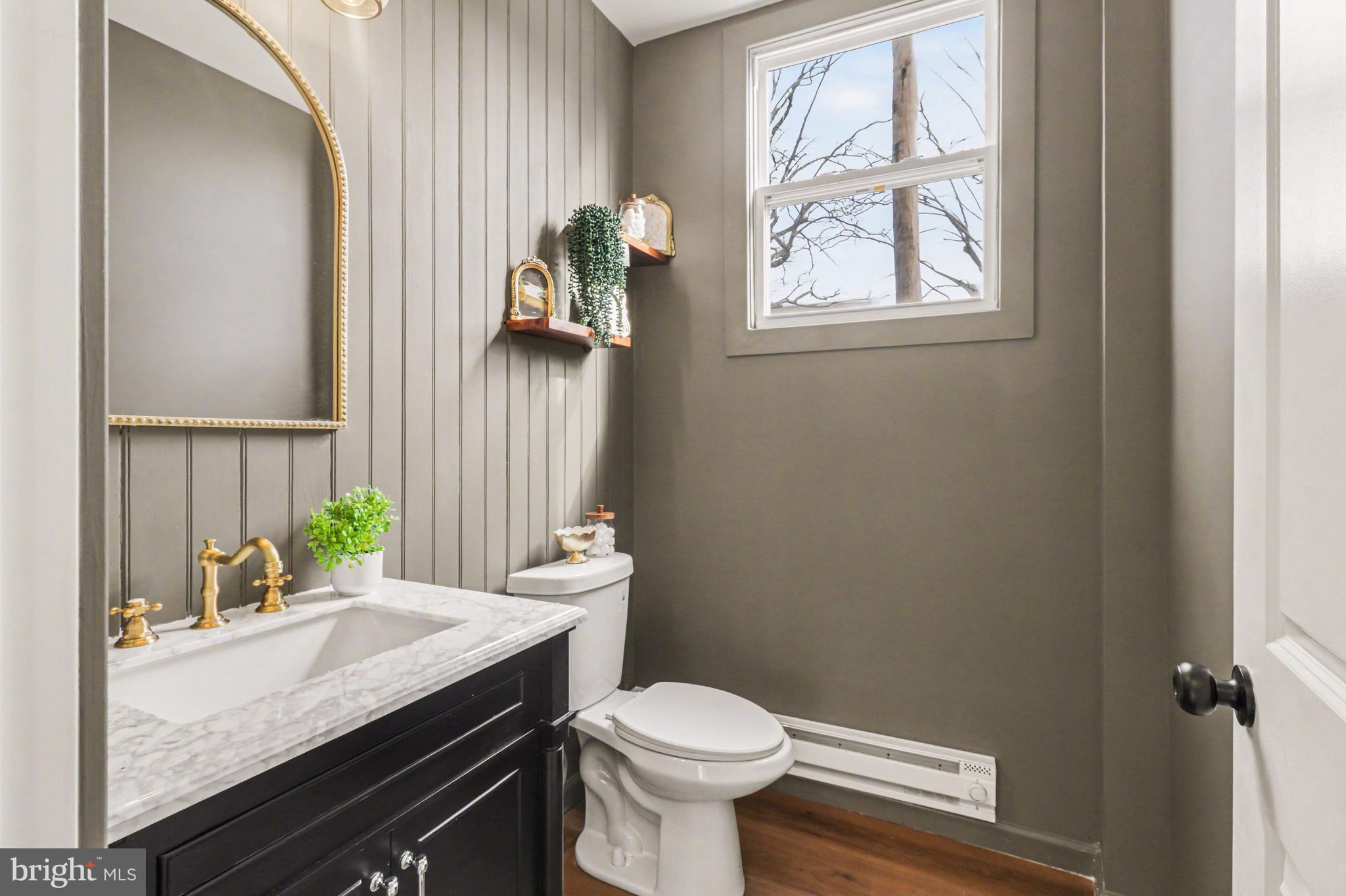 1006 Colebrook Road Lebanon, PA 17042 - Photo 15 of 41 a bathroom with a granite countertop toilet sink and mirror