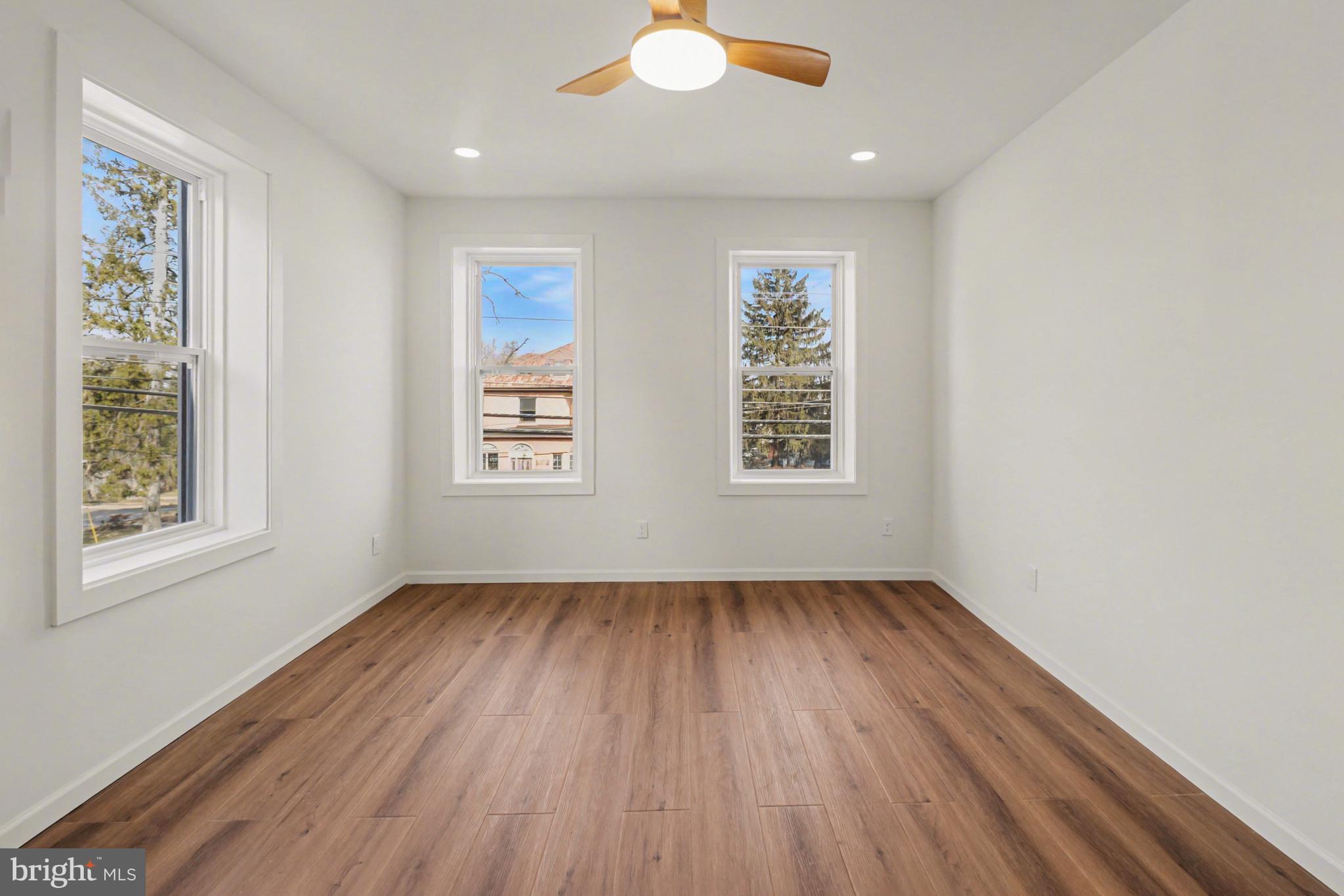 1006 Colebrook Road Lebanon, PA 17042 - Photo 16 of 41 an empty room with wooden floor and windows
