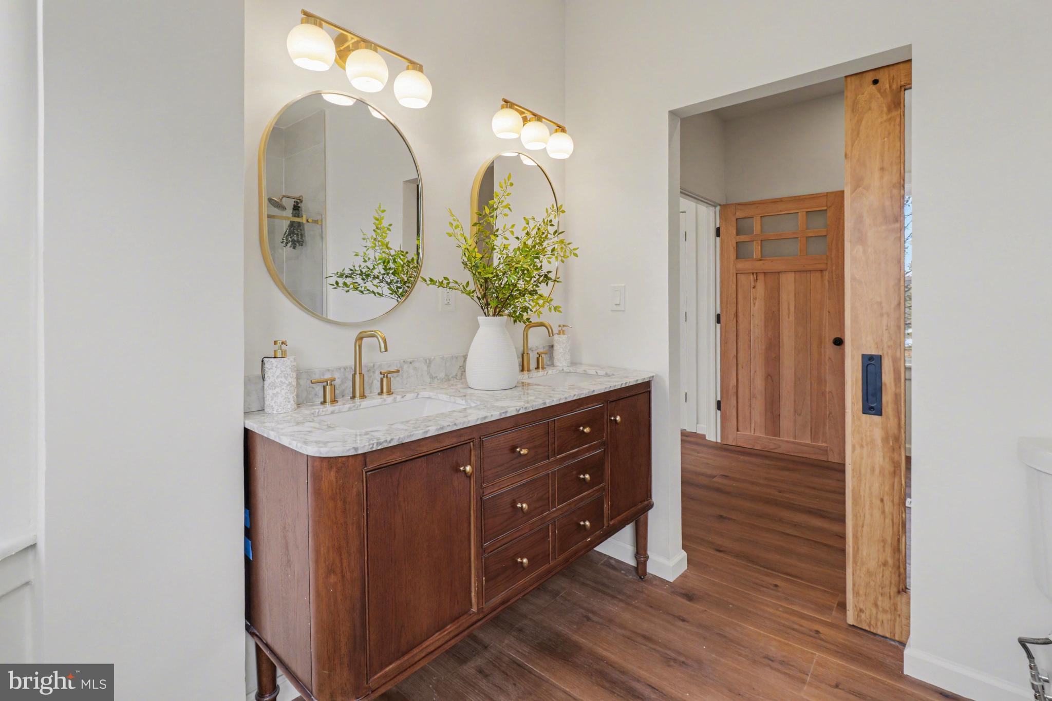 1006 Colebrook Road Lebanon, PA 17042 - Photo 19 of 41 a bathroom with a double vanity sink and a mirror
