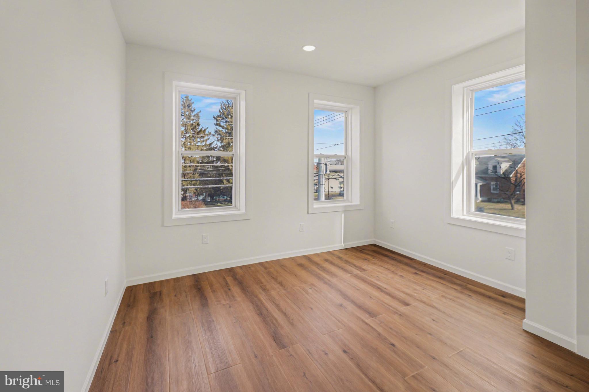 1006 Colebrook Road Lebanon, PA 17042 - Photo 20 of 41 a view of an empty room with wooden floor and a window