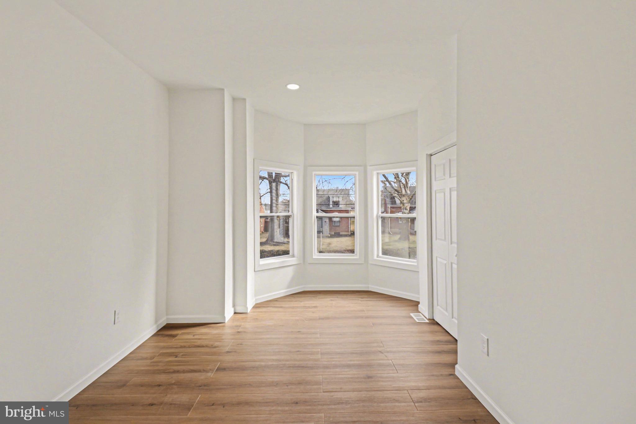 1006 Colebrook Road Lebanon, PA 17042 - Photo 22 of 41 a view of an empty room with wooden floor and a window