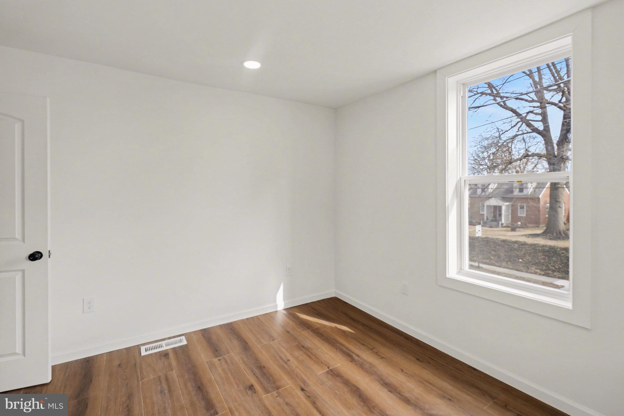 1006 Colebrook Road Lebanon, PA 17042 - Photo 26 of 41 an empty room with wooden floor and windows