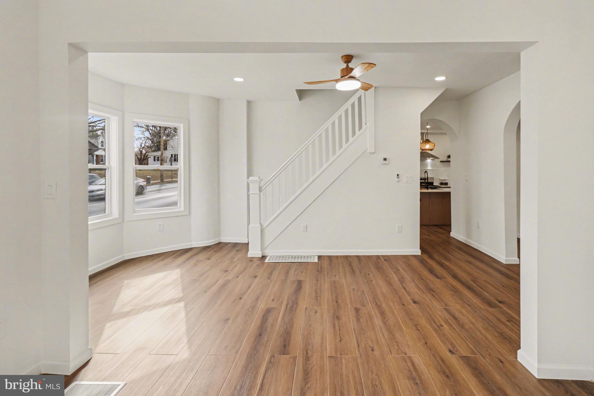 1006 Colebrook Road Lebanon, PA 17042 - Photo 6 of 41 a view of an empty room with wooden floor and a window