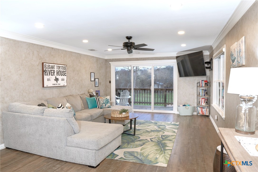 582 Cypress Valley Road Cuero, TX 77954 - Photo 18 of 46 a living room with furniture and a large window