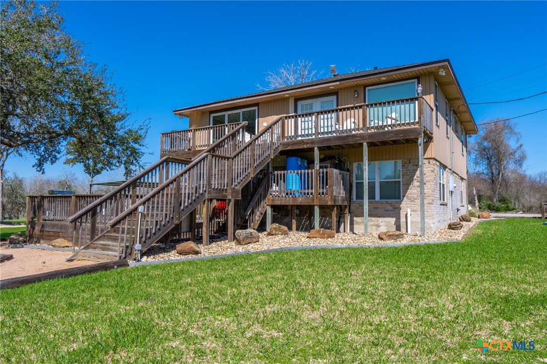 582 Cypress Valley Road Cuero, TX 77954 - Photo 31 of 46 a view of a house with a yard