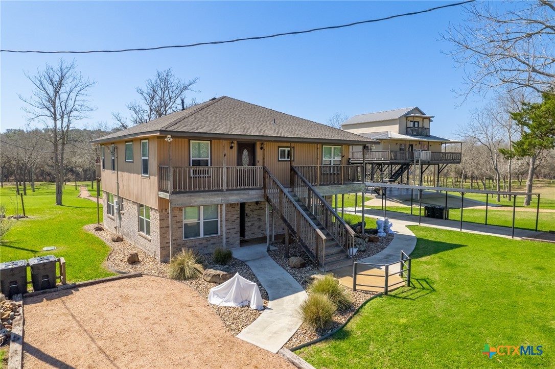 582 Cypress Valley Road Cuero, TX 77954 - Photo 33 of 46 a view of a house with backyard porch and sitting area
