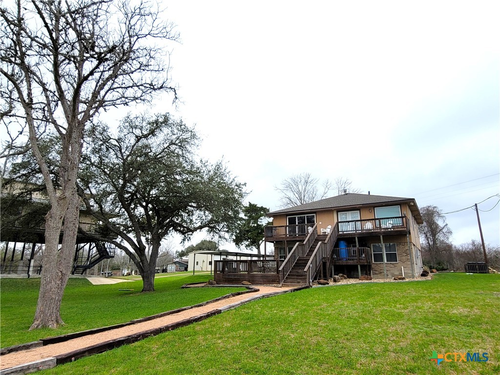 582 Cypress Valley Road Cuero, TX 77954 - Photo 40 of 46 a view of a house with a yard