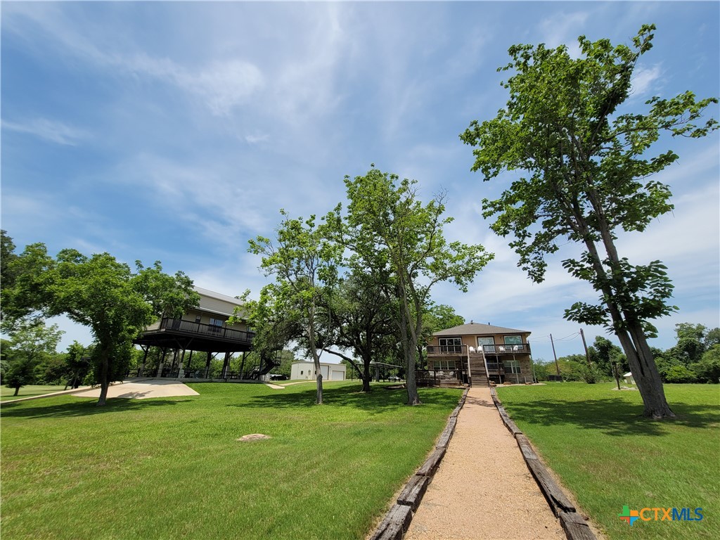 582 Cypress Valley Road Cuero, TX 77954 - Photo 46 of 46 a front view of a house with garden
