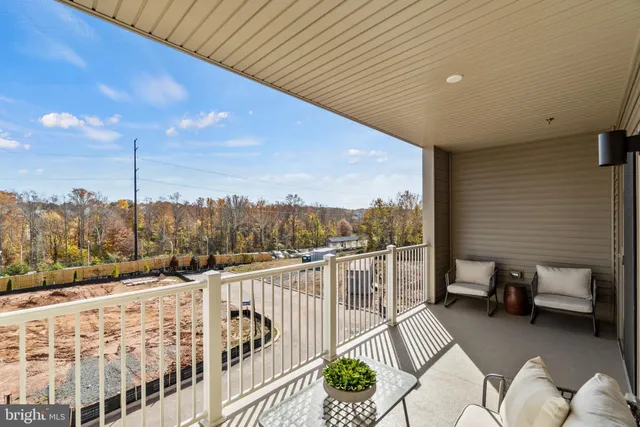 a view of a balcony with furniture