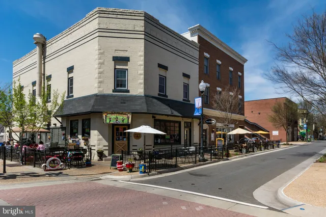 a view of a street with cars on city street