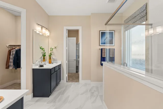 a view of a bathroom with a tub and a view of bathroom