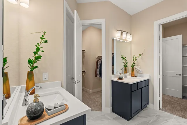 a bath room with a sink and a mirror
